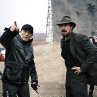 Still of Christian Bale and Yimou Zhang in The Flowers of War