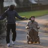 Still of François Cluzet and Omar Sy in The Intouchables