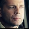Bruce Willis, starring as David Dunn, on the train that will change his life - Photo Credit: Frank Masi. S.M.P.S.P.
