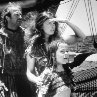 Still of Kevin Costner, Jeanne Tripplehorn and Tina Majorino in Waterworld