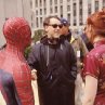 Director SAM RAIMI discusses a scene with stars TOBEY MAGUIRE (as Spider-Man) and KIRSTEN DUNST on the set of Columbia Pictures' action adventure SPIDER-MAN.