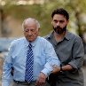 Still of Peyman Moadi and Ali-Asghar Shahbazi in A Separation