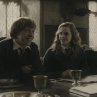 Still of Rupert Grint and Emma Watson in Harry Potter and the Half-Blood Prince