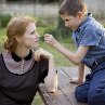 Still of Jessica Chastain and Tye Sheridan in The Tree of Life