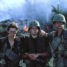 Still of Charlie Sheen, Tom Berenger and Willem Dafoe in Platoon